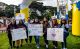 Lambda Theta Alpha members hold posters at the 2023 San Francisco St. Jude Walk Run. 