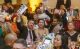 An attendee raises an auction ballot at the 2023 St. Jude Miracles on the Bay. 