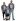 St. Jude patient Braylan stands between his parents in a photo studio setting..