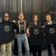 Image of Music Gives artist for St. Jude Kings of Leon wearing the black Music Gives tshirt.