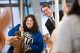 A man and woman ride the carousel at volunteer appreciation event