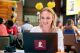 St. Jude No More Cancer Rally supporter working on laptop
