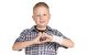 St. Jude patient Brayden makes a heart with his fingers.