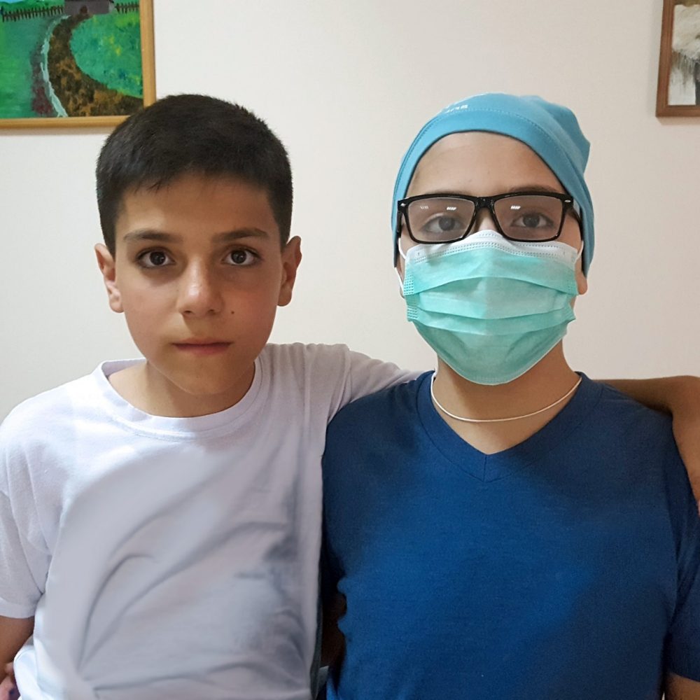 Gheorghe (right) and his brother, Andrei (left) before the final stage of treatment.