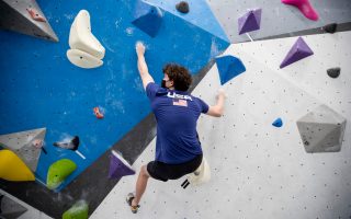 St. Jude patient Micah climbs a colorful rock wall