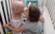 Twins are inseparable after one is treated for brain cancer at St. Jude