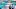 two men in blurred background of server room