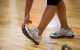 hand pulling toes up to stretch shin and achilles tendon
