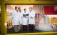 Dr. Kriwacki, Dr. Zuo, Dr. Shelat and Dr. Iconaru discuss research topics next to the NMR spectrometer