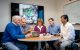 Researchers talking around table