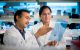 Subbarao Malireddi, left, points at an overhead projector sheet explaining what he sees to Thirumala-Devi Kanneganti, PhD. What they found may provide insight into preventing septic shock, an often lethal overreaction of the immune system to an infection.