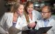 Kathryn Roberts, Ph.D., Michelle Churchman, Ph.D., and Zhaohui Gu, Ph.D., look at files at a desk