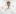 Doctor with stethoscope wearing a lab coat and smiling and standing in front of a colorful background.