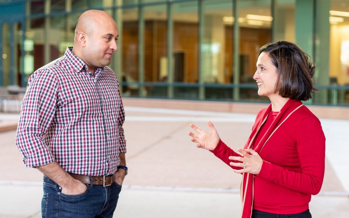 Two scientists, Paulina Velasquez and Nikhil Hebbar, stand outside of the Inspiration 4 Advanced Research Center at St. Jude