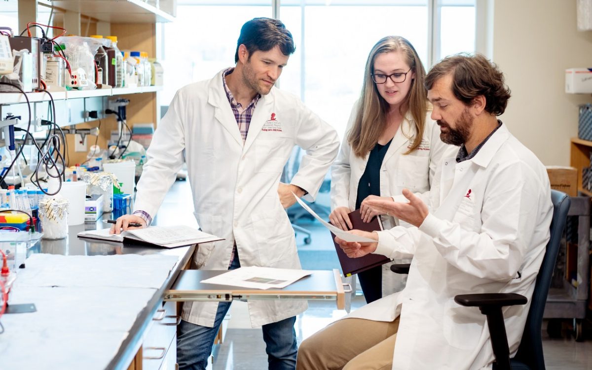 Three scientists in their developmental neurobiology lab.