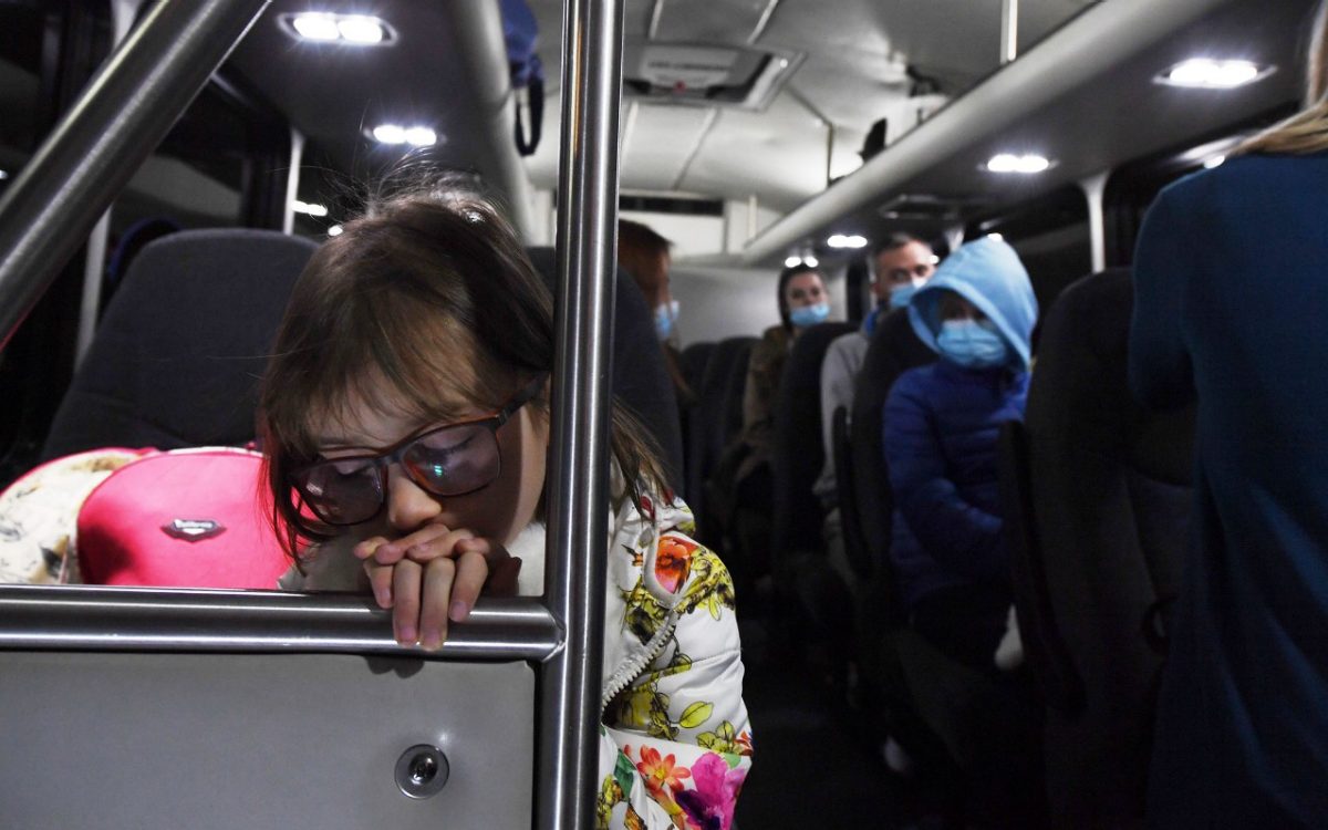 Ukrainian child asleep on bus