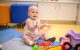 St. Jude patient Eden playing with toys. 