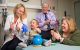 Ewelina Mamcarz, MD, with patient family in clinic