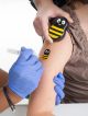 Buzzy is being used for a vaccination.