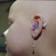 Child with hearing aid