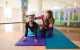 Jessica Sparrow teaches yoga to patient Trinity