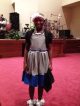 Da’Maya viste su ropa más fina para ir a la iglesia.