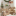 Pottery Barn Kids ivory Teddy bear shaped chairs that are featured in a child's room.