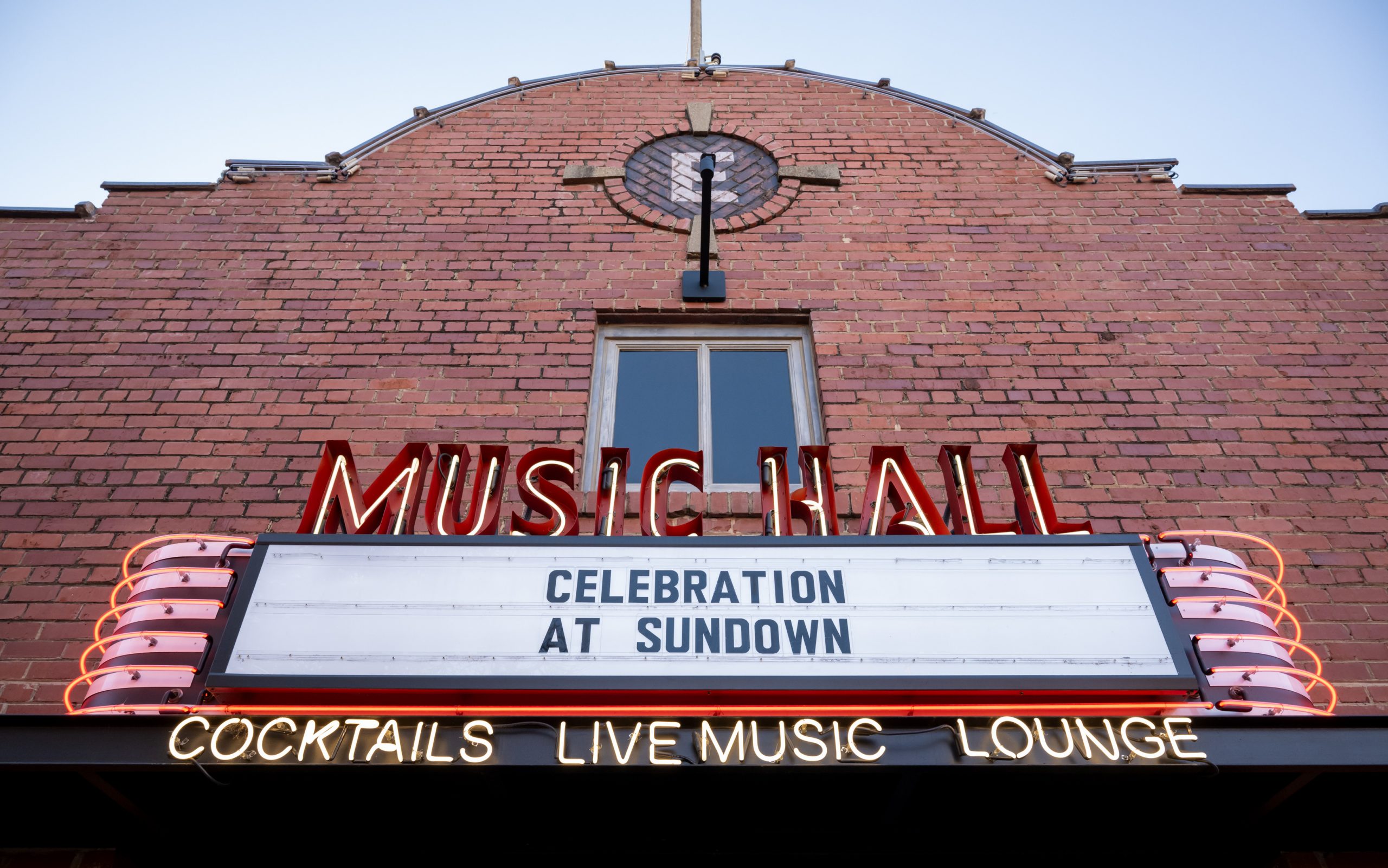"Celebration at Sundown" written on the Music Hall marquis. 