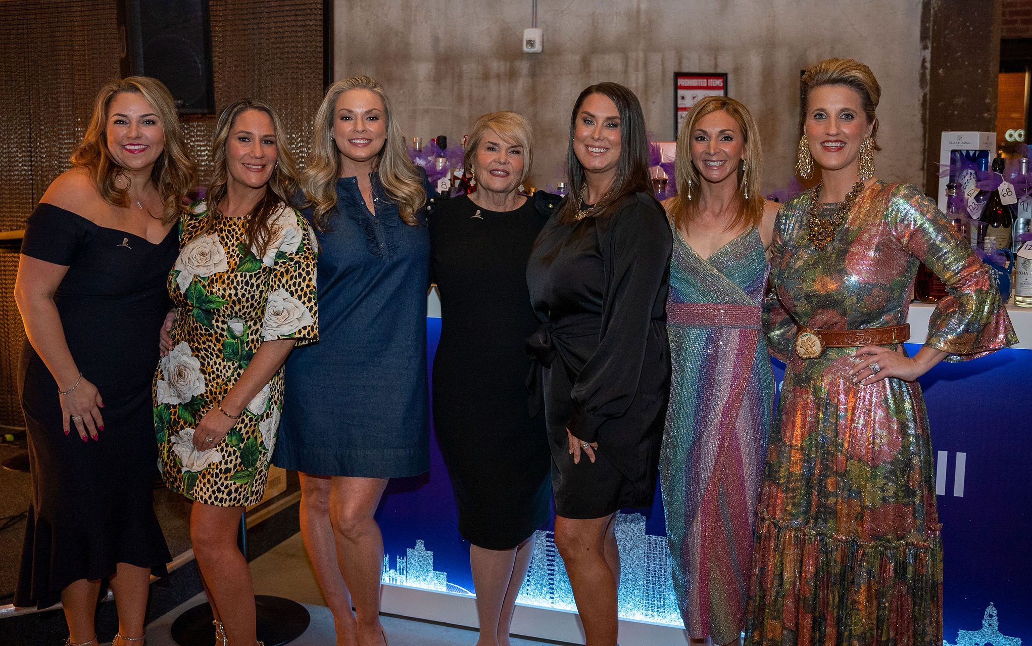 A group of women pose at the Celebration at Sundown silent auction. 