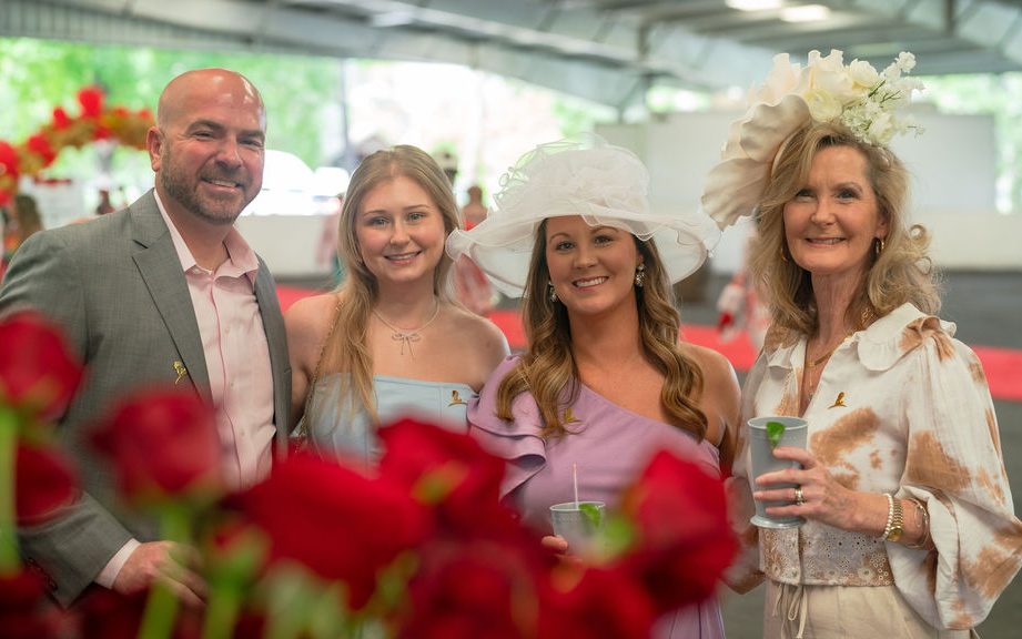 St. Jude A Day at the Derby attendees pose in festive derby attire. 