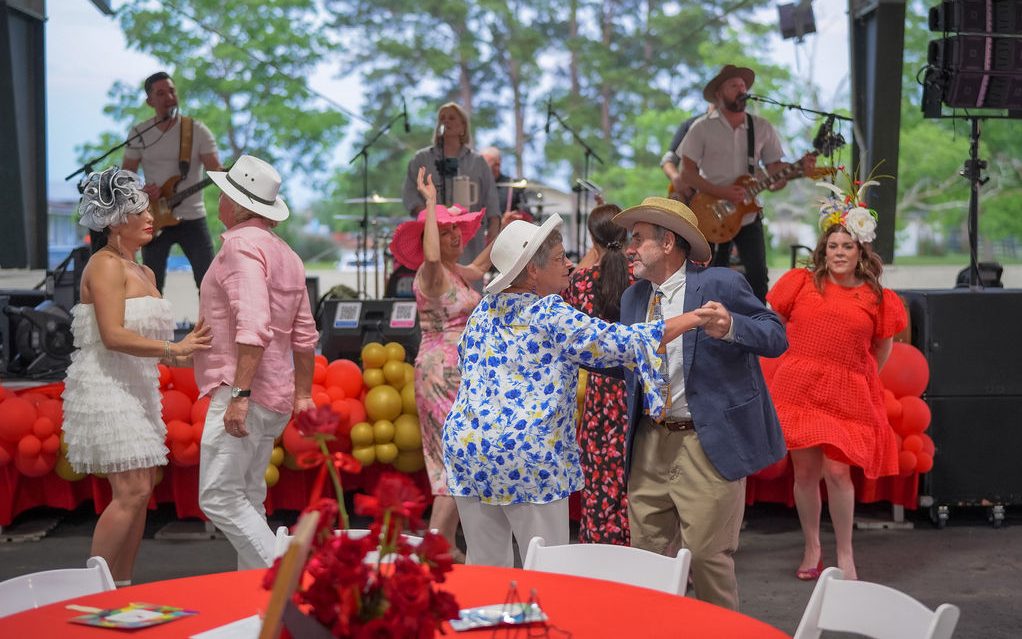 St. Jude A Day at the Derby attendees dance while musicians perform. 