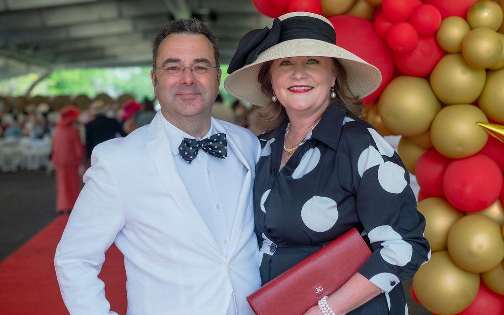 St. Jude A Day at the Derby attendees pose wearing festive Derby attire. 